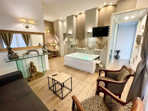 a living room with a couch and a table at Sebastian's Elegant Apartment in Aci Castello