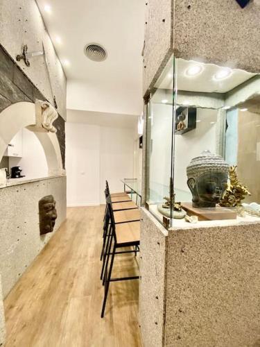 a room with a museum with a vase on display at Sebastian's Elegant Apartment in Aci Castello