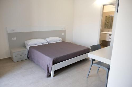 Postel nebo postele na pokoji v ubytování Salerno Rooms