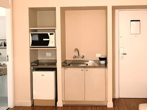 Kuchyň nebo kuchyňský kout v ubytování Flat no melhor local do Centro/Batel