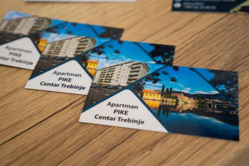 four cards on a table with cities on them at Apartman Pike centar in Trebinje