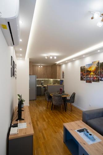 a living room with a couch and a table at Apartman Pike centar in Trebinje
