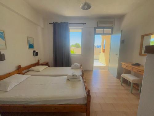 Ένα ή περισσότερα κρεβάτια σε δωμάτιο στο Fedra Apartments