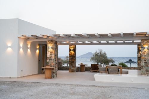 a patio with a view of the ocean at Kyma Suite in Kithnos