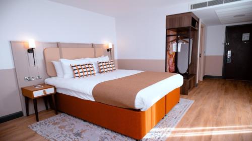 a bedroom with a large bed in a room at Hotel Indigo Coventry by IHG in Coventry