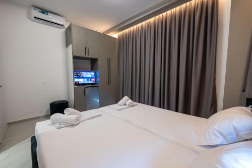 Postel nebo postele na pokoji v ubytování Euphoria Apartments