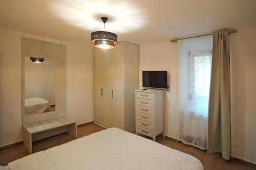 Postel nebo postele na pokoji v ubytování La Corte di GreSi