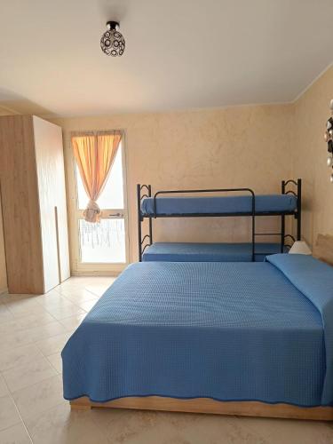 Ένα ή περισσότερα κρεβάτια σε δωμάτιο στο Casa Terry Galatina
