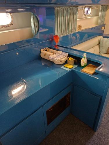 a blue counter top in a bathroom with a sink at Miss Mary in Porto Santa Margherita di Caorle