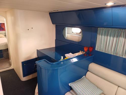 a small room with blue walls and a blue counter at Miss Mary in Porto Santa Margherita di Caorle