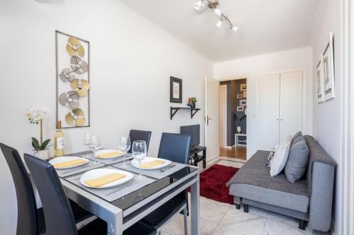 a dining room with a table and chairs at Lisbon Relax Pool Apartment - Free Parking Garage in Lisbon