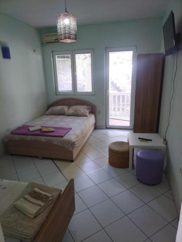 Cama o camas de una habitación en Apartmani Pikula