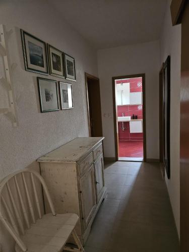 a room with a table and a chair and a door at Klara in Vodice