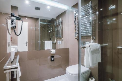 Ένα μπάνιο στο Plaza V Executive Hotel