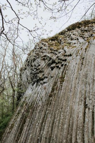 an old stone wall with trees in the background at Somoskabin in Salgótarján