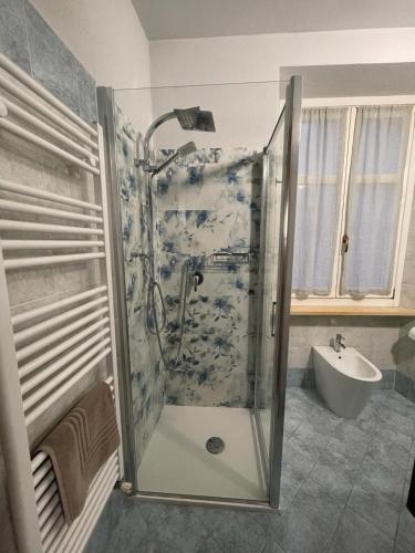 a bathroom with a shower and a sink at Asfodelo rooms in Bra