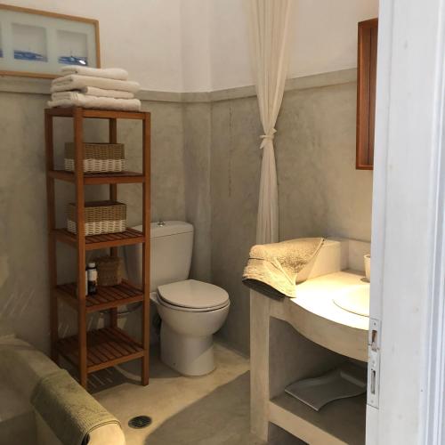 a bathroom with a toilet and a sink at Almyra Kythera in Agia Pelagia Kythira