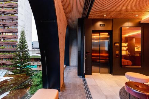 a lobby with a view of a building at Primavera Luxury Apartments Medellin in Medellín