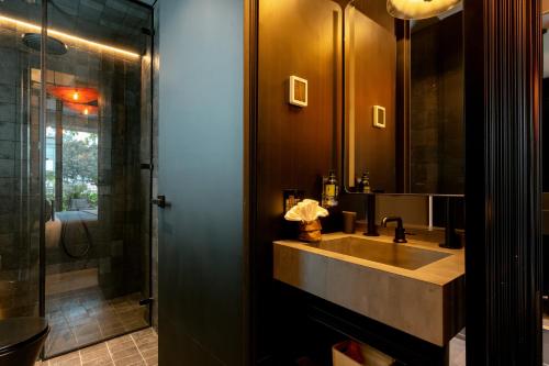 a bathroom with a sink and a shower at Primavera Luxury Apartments Medellin in Medellín
