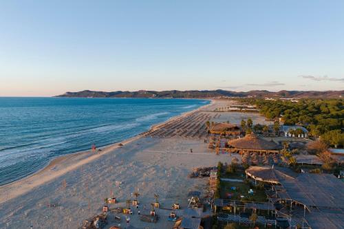 an aerial view of a beach with umbrellas and the ocean at Perla Penthouse - Happy Rentals in Mullini i Danit