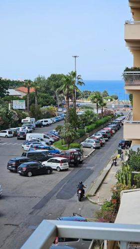 a view of a street with cars parked in a parking lot at Casa Sole e Luna in Reggio Calabria
