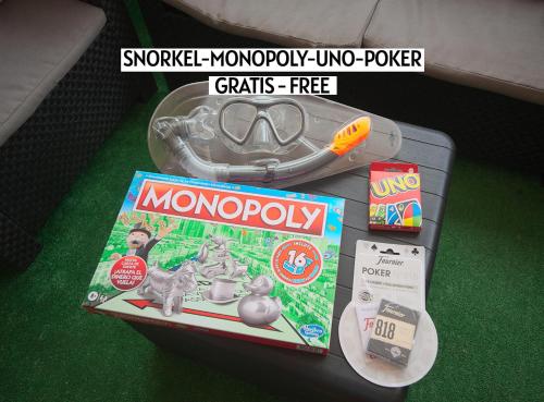 a monopoly game and a box of monopolyavascript at Apartalux Magic Gold in Oropesa del Mar