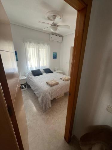 a bedroom with a bed and a ceiling fan at La Marquesa Golf 3 bedroom Detached Villa in Ciudad Quesada