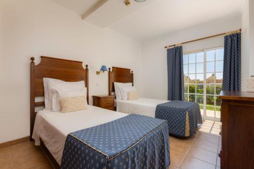 Ένα ή περισσότερα κρεβάτια σε δωμάτιο στο Villas Barrocal
