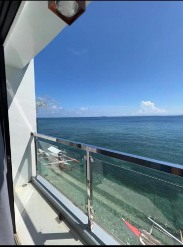 a view of the ocean from the balcony of a cruise ship at Casa Rosita Beach Front House in Surigao