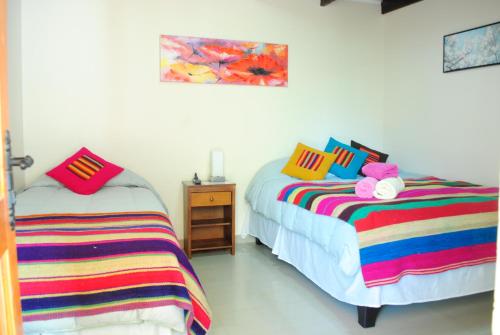 Una cama o camas en una habitación de Anka Hostel