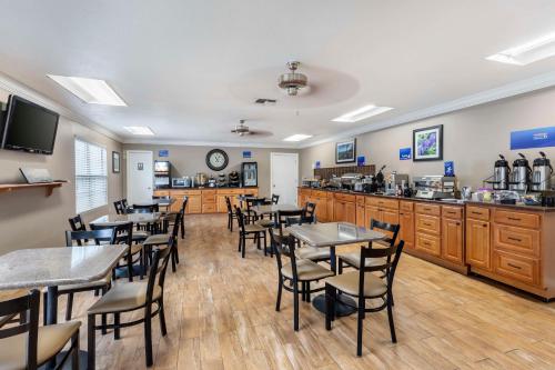 a restaurant with tables and chairs and a counter at Best Western of Hope in Hope