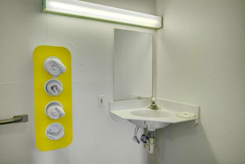 a bathroom with a sink and a mirror at Motel 6-Lima, OH in Lima