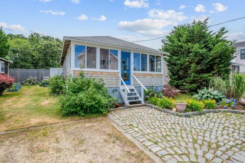 a home with a stone walkway to the front door at 17 Captain Dunbar Road Brewster - Prestons Haven in Brewster