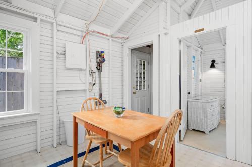 a dining room with a wooden table and chairs at 17 Captain Dunbar Road Brewster - Prestons Haven in Brewster