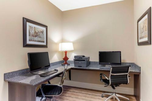 an office with two computers and a desk with two chairs at Best Western Plus Burleson Inn & Suites in Burleson