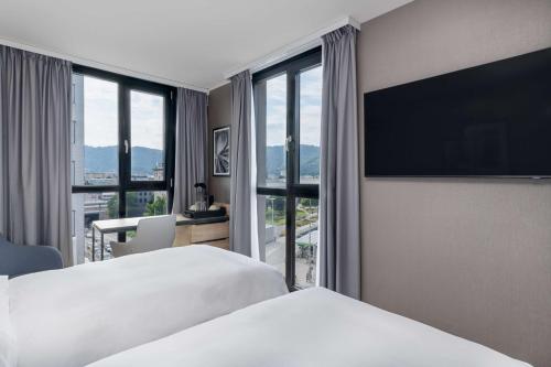 Postel nebo postele na pokoji v ubytování Radisson Hotel Graz