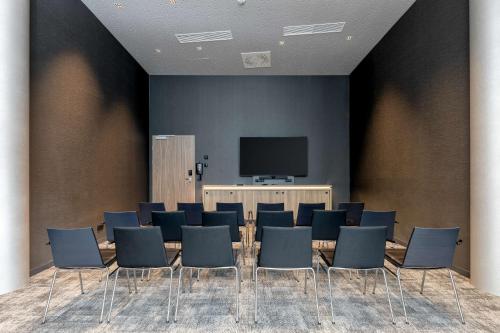 TV a/nebo společenská místnost v ubytování Radisson Hotel Graz