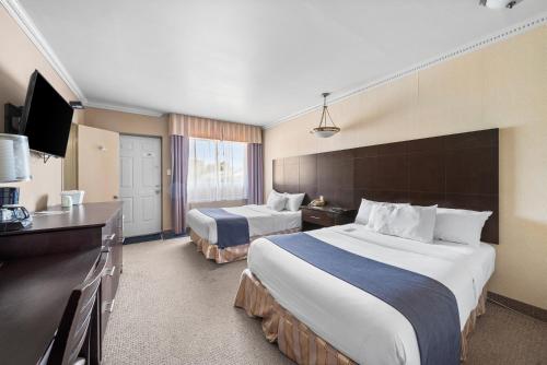Ένα ή περισσότερα κρεβάτια σε δωμάτιο στο Hotel-Motel Coconut