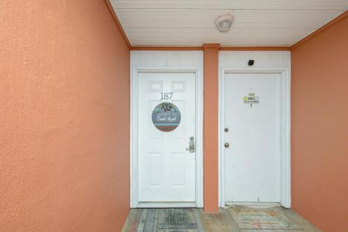 a white door in a room with an orange wall at Cool Azul 3 Community Pools Central Destin in Destin