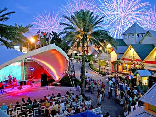 a crowd of people at an outdoor event with fireworks at Cool Azul 3 Community Pools Central Destin in Destin