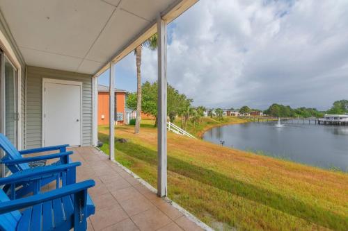 a porch with a blue bench and a view of a lake at Hook Line Double Sinker Lake View 3 Comm Pools in Destin
