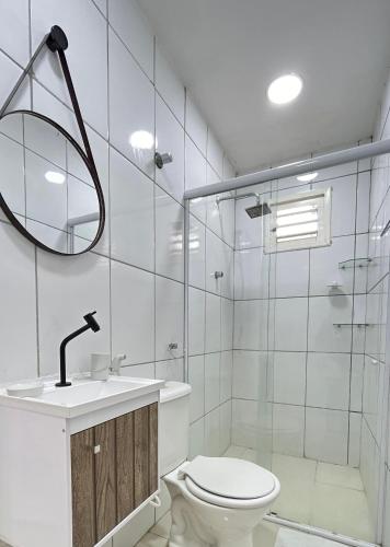 a bathroom with a toilet and a sink and a shower at FlatStudio02 na Nova Betânia - INNOVA in Mossoró