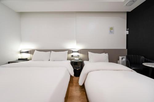 Ένα ή περισσότερα κρεβάτια σε δωμάτιο στο Amare Hotel Jongno