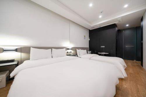 Ένα ή περισσότερα κρεβάτια σε δωμάτιο στο Amare Hotel Jongno