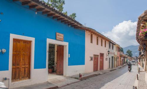 a blue and white building on the side of a street at Hotel Miramar in San Cristóbal de Las Casas