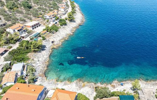 an aerial view of a beach with blue water at Holiday Home Prigradica With Fireplace 06 in Prigradica