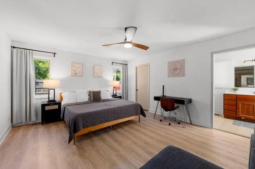 a bedroom with a bed and a desk in it at New Bensenville Home by O'Hare Airport with Indoor Pool, Sauna, and Arcade in Bensenville