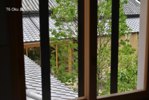 a view from a window of a stairway at 滔々 倉敷民藝館南の宿 toutou, Mingeikan Minami no Yado in Kurashiki