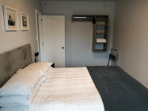 a bedroom with a large bed in a room at Akaroa Village Inn in Akaroa