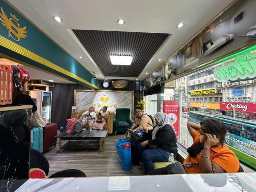 a group of people sitting inside of a store at SS Grey Hotel 2 in Kuala Lumpur